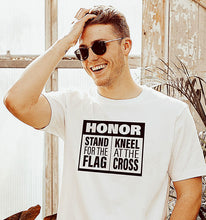Load image into Gallery viewer, Man with a Stand for the Flag and Kneel at the Cross t shirt on from For Liberty Sake.