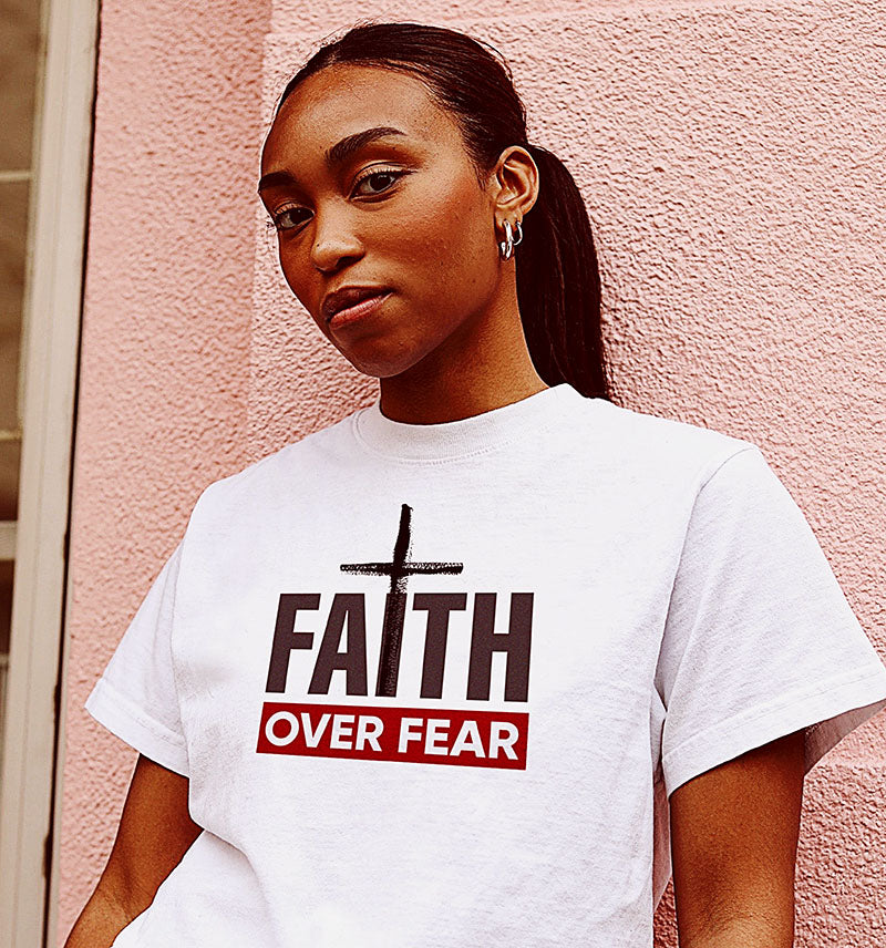 A young woman in a Faith Over fear t shirt.