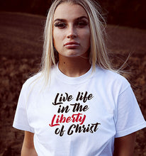 Load image into Gallery viewer, A woman in our Live Life in the Liberty of Christ t shirt.
